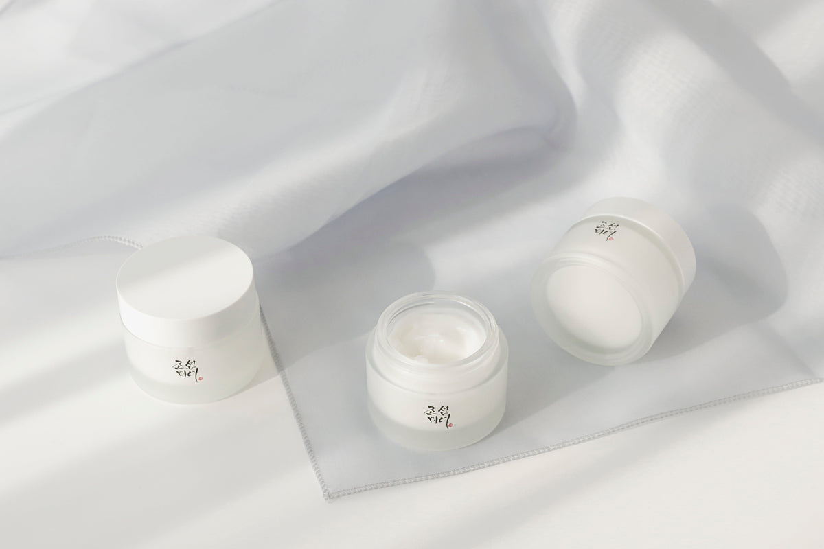 a group of small containers of cream